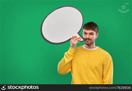 communication, mass media and people concept - happy smiling young man with speech bubble over emerald green background. happy man with speech bubble over green background