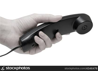 Communication on white. office black telephone with hand dialing.