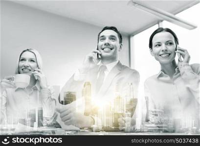 communication, technology and people concept - smiling business team with smartphones making calls at office over city buildings and double exposure effect. business team with smartphones working at office