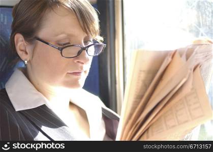 commuter reading paper