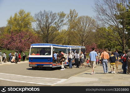 Commuters boarding a bus on the road