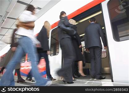 Commuters Getting on a Train