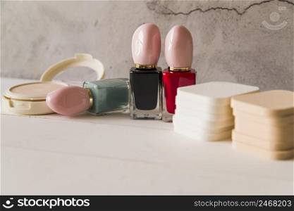 compact powder nail polish bottle sponges table