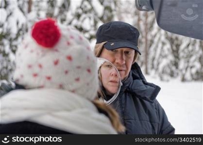 Companion portrait of happy middle-aged couple on a winter day