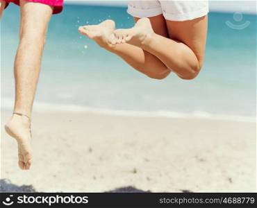 Company of jumping people on the beach. Company of jumping people on the beach with only legs photographed