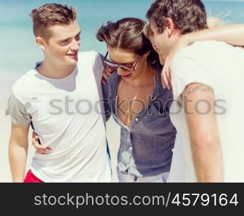 Company of young people on the beach. Company of young friends on the beach walking and having fun