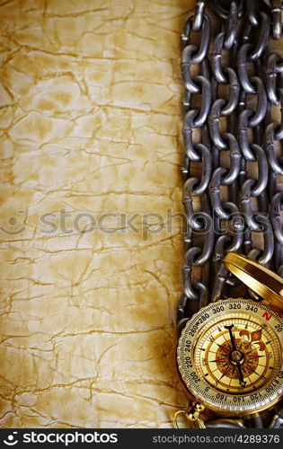Compass, anchor and chain on vintage old paper background