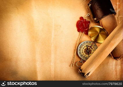 compass, ancient scroll with red wax seal on old paper as a background