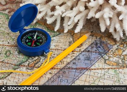 compass and coral on the map