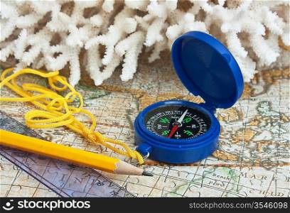 compass and coral on the map