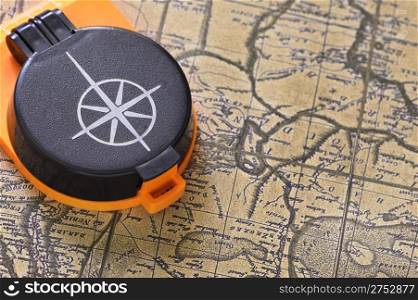 Compass and old map. Processing of a antique photo