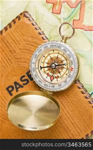 compass and passport on the map