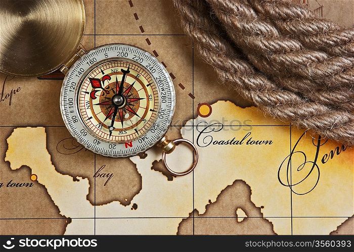compass and rope on a map