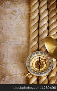 Compass and rope on vintage old paper background
