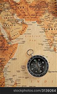 compass on old world map