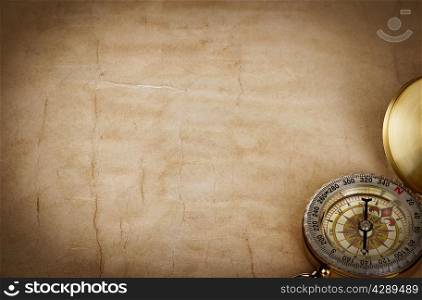 Compass on vintage old paper background