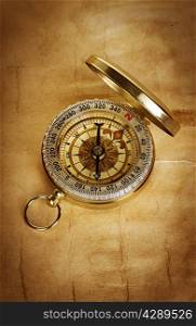 Compass on vintage old paper background