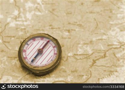 Compass over the topographic map- concept background