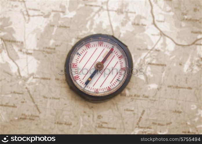Compass over the topographic map- concept background