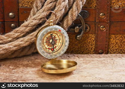 Compass rope and wooden chest, still life