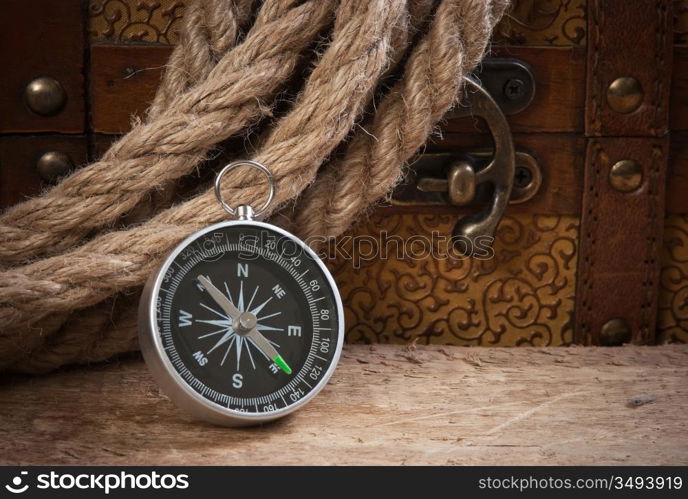 Compass rope and wooden chest, still life