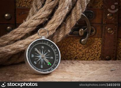 Compass rope and wooden chest, still life