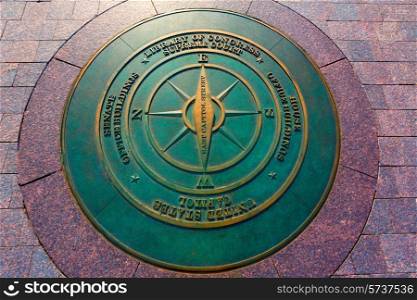 compass symbolic on washington DC ground near Capitol building