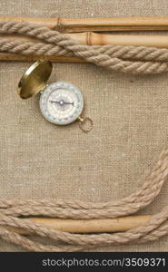 Compass with ropes and bamboo on a canvas