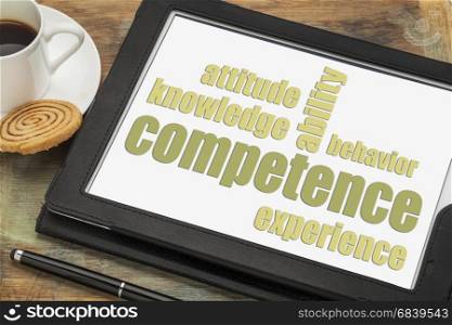 competence concept - word abstract on a digital tablet with a cup of espresso coffee