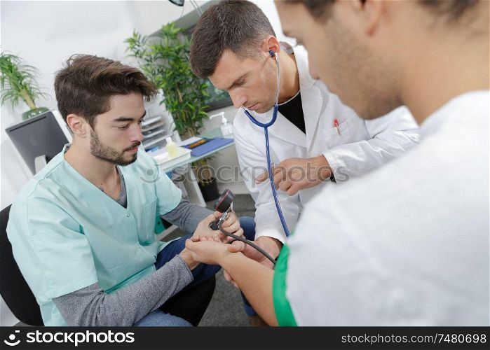 competent male nurse with doctor