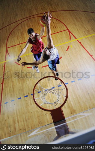 competition cencept with people who playing and exercise basketball sport in school gym