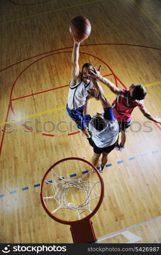 competition cencept with people who playing and exercise basketball sport in school gym