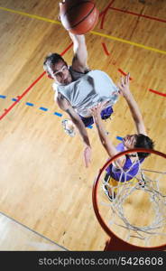 competition cencept with people who playing basketball in school gym