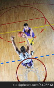 competition cencept with people who playing basketball in school gym