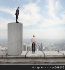 Competitive business. Conceptual image of businessman standing on bar and looking down at woman