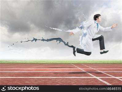 Competitive business. Funny image of doctor running at stadium