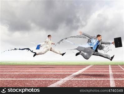 Competitive business. Funny image of young businesspeople running at stadium