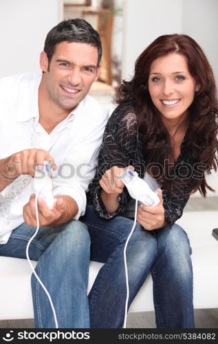 Competitive couple playing video games