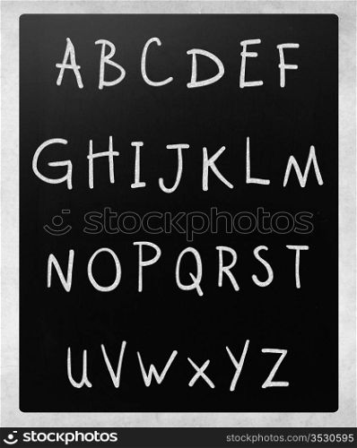 Complete english alphabet handwritten with white chalk on a blackboard