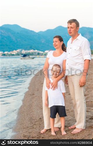 complete family with son on the sea shore