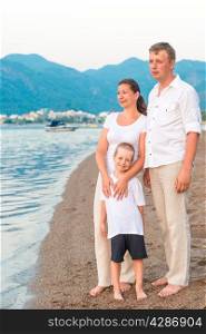 complete family with son on the sea shore