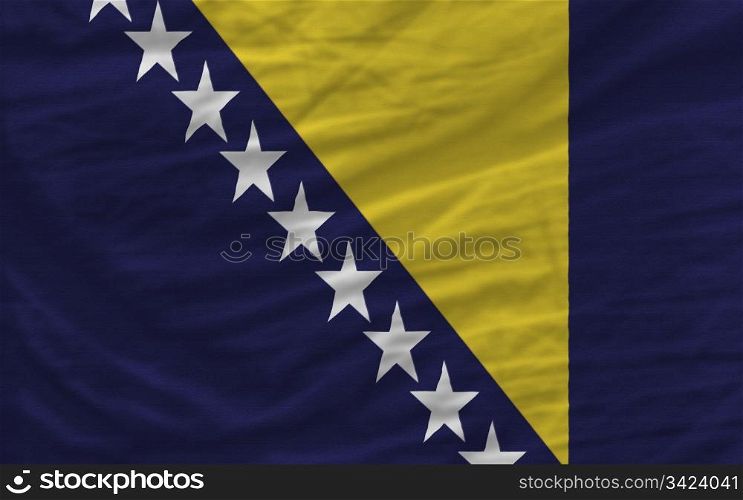 complete national flag of bosnia herzegovina covers whole frame, waved, crunched and very natural looking. It is perfect for background