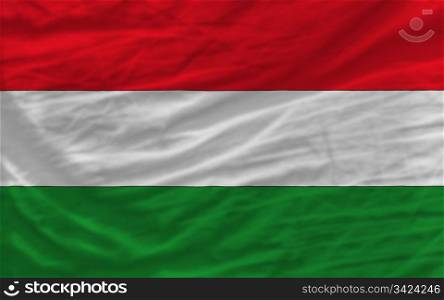 complete national flag of hungary covers whole frame, waved, crunched and very natural looking. It is perfect for background