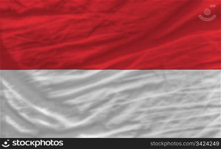 complete national flag of indonesia covers whole frame, waved, crunched and very natural looking. It is perfect for background