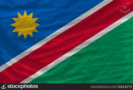 complete national flag of namibia covers whole frame, waved, crunched and very natural looking. It is perfect for background