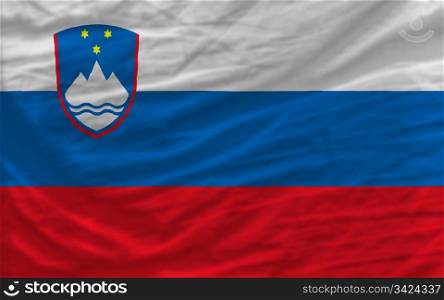 complete national flag of slovenia covers whole frame, waved, crunched and very natural looking. It is perfect for background