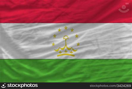 complete national flag of tajikistan covers whole frame, waved, crunched and very natural looking. It is perfect for background