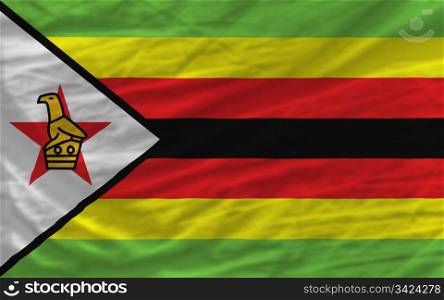 complete national flag of zimbabwe covers whole frame, waved, crunched and very natural looking. It is perfect for background