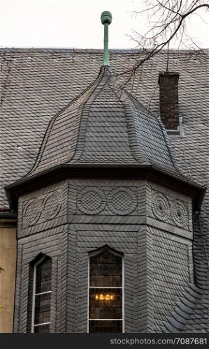 Completely covered with black slate from small slate slabs past the old district court in the old town of the Harz city