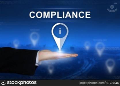 compliance button with business hand on blurred background